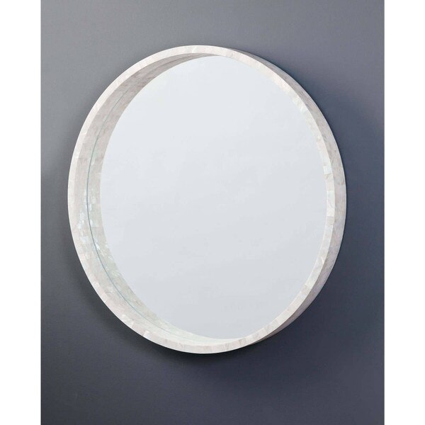 Gray wall with a Mother of Pearl Mirror hung on it